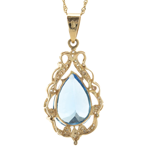 18 Karat Yellow Gold Pear Cut Blue Topaz and Diamond Freeform Pendant