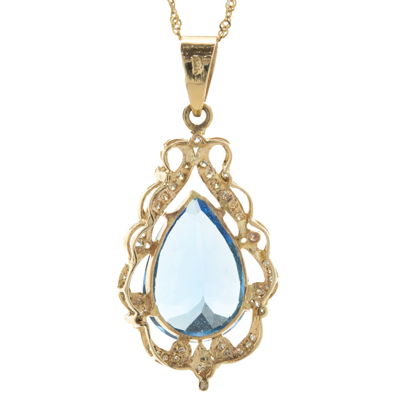 18 Karat Yellow Gold Pear Cut Blue Topaz and Diamond Freeform Pendant