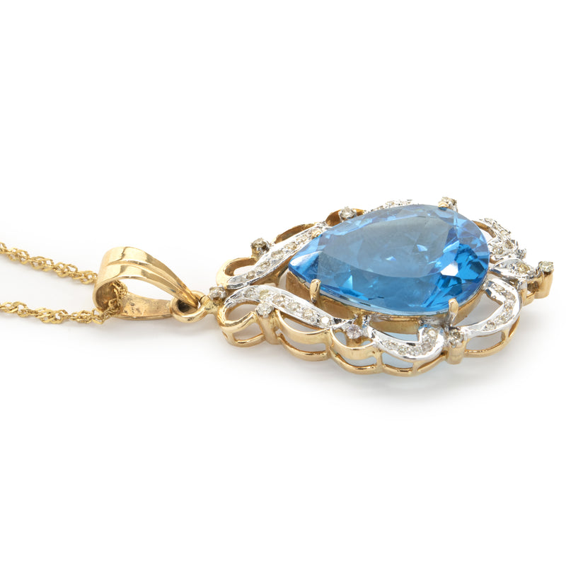 18 Karat Yellow Gold Pear Cut Blue Topaz and Diamond Freeform Pendant