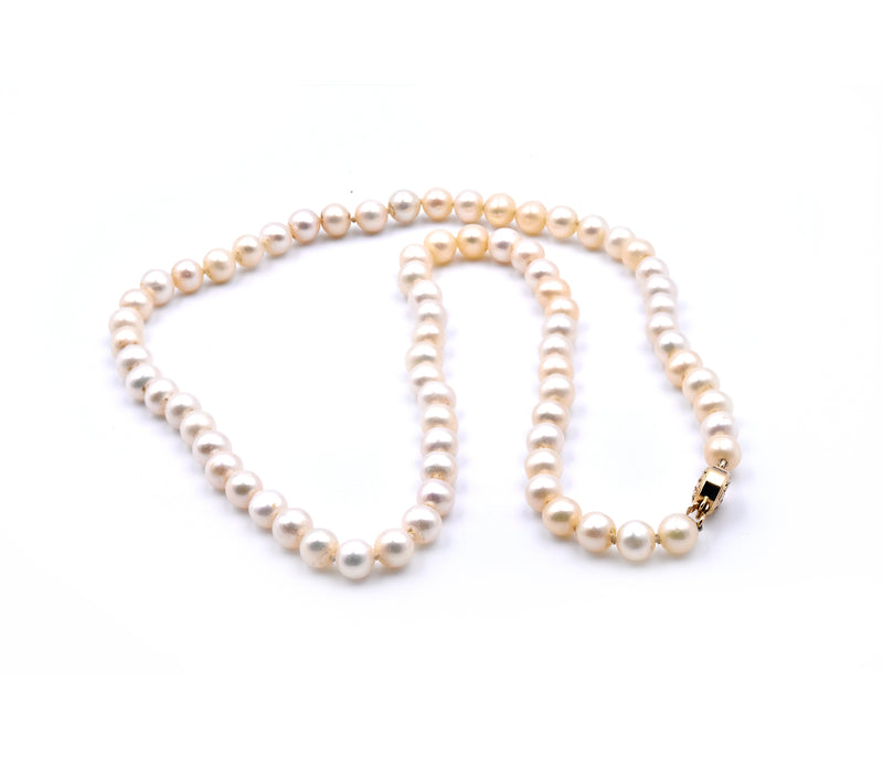 Ivory Semi Round Pearl Strand Necklace with 14 Karat Yellow Gold Clasp
