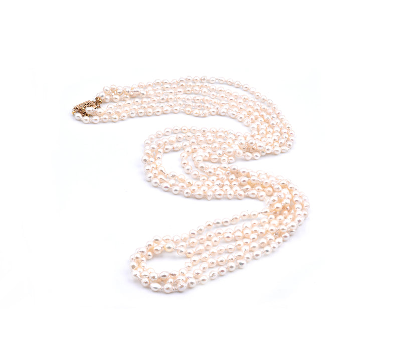 Baroque Seed Pearl Triple Strand Necklace with 14 Karat Yellow Gold Clasp