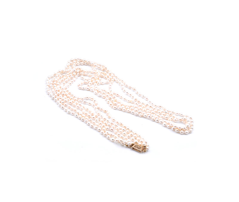 Baroque Seed Pearl Triple Strand Necklace with 14 Karat Yellow Gold Clasp